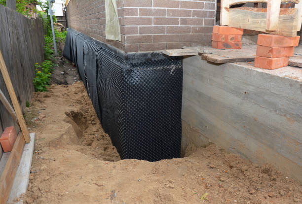 SJ Waterproofing Pros technician performing targeted Emergency Waterproofing assessment in Merion Station, PA